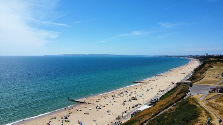 Aerial view of Bournemouth beach and coastline from a drone